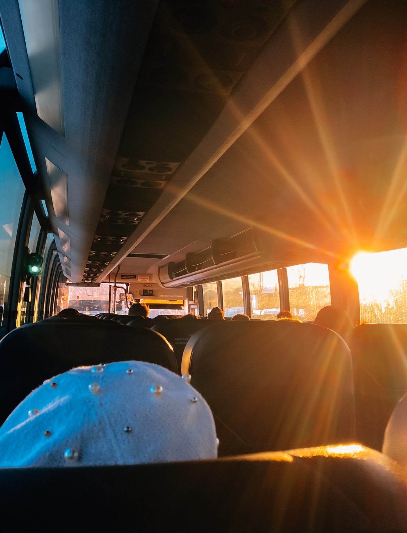 bus-trip-passengers-on-a-bus-with-sun-shining-through-window.jpg